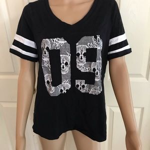 Torrid black T-shirt With skulls size medium.